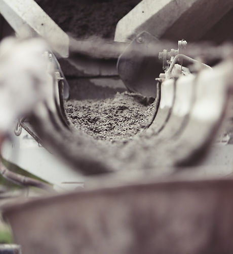 Close view of concrete being poured