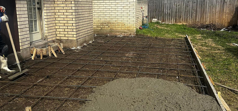 Concrete pour in progress over reinforcement